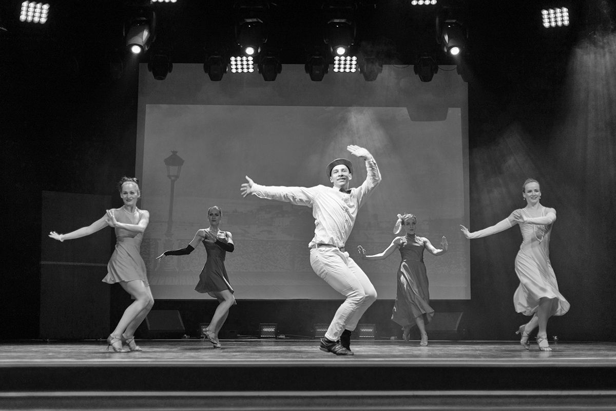 Dancer Actors perform on the theater stage in a dance show musical.