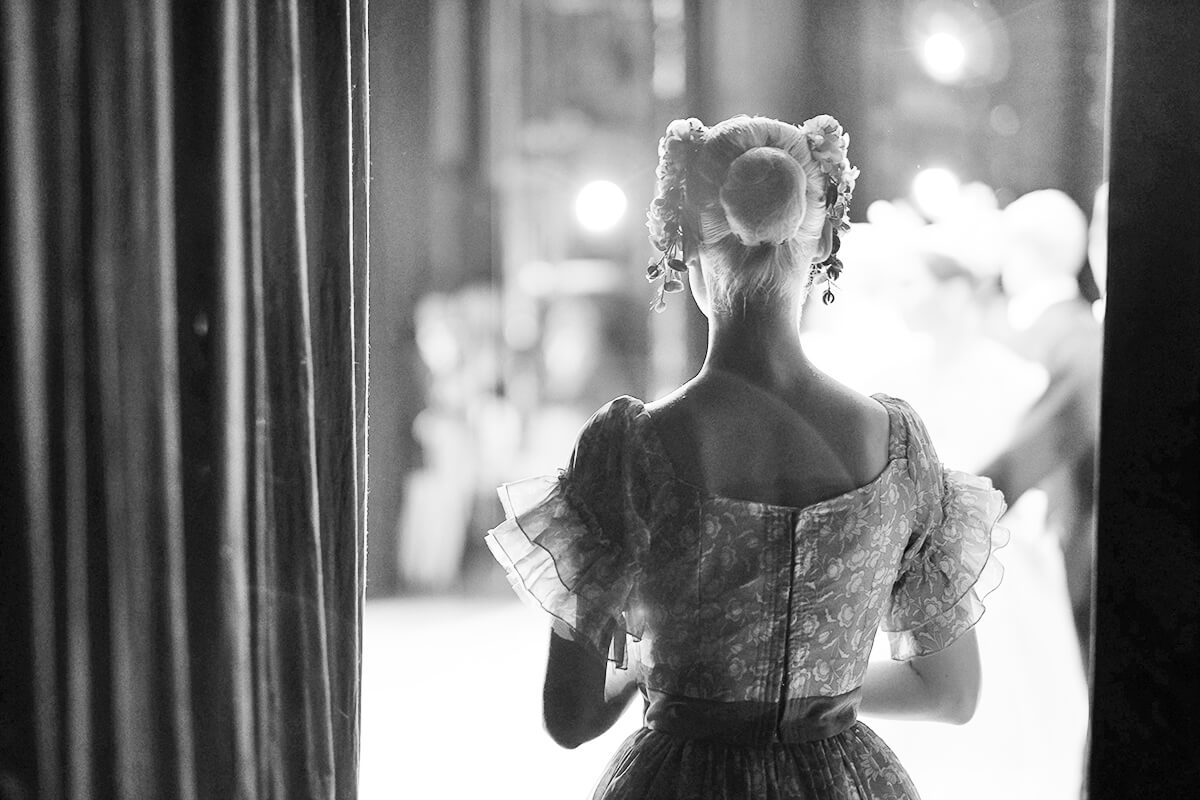 A ballerina awaiting the moment of entering the stage in the play.