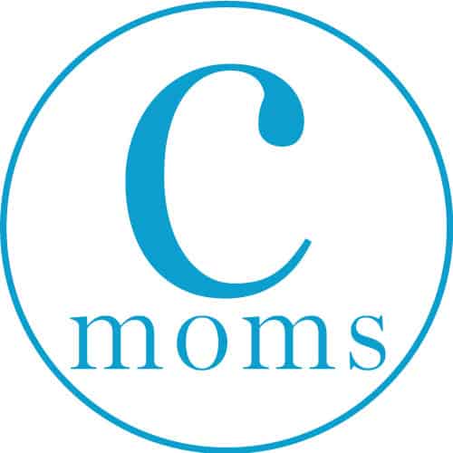 A white circle with a blue border with blue text reading "c moms" inside
